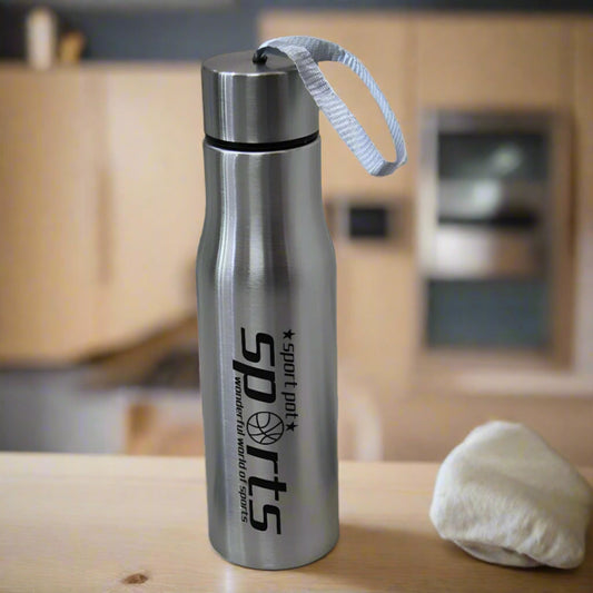 Silver water bottle with 'Sport Dad' branding on a wooden surface